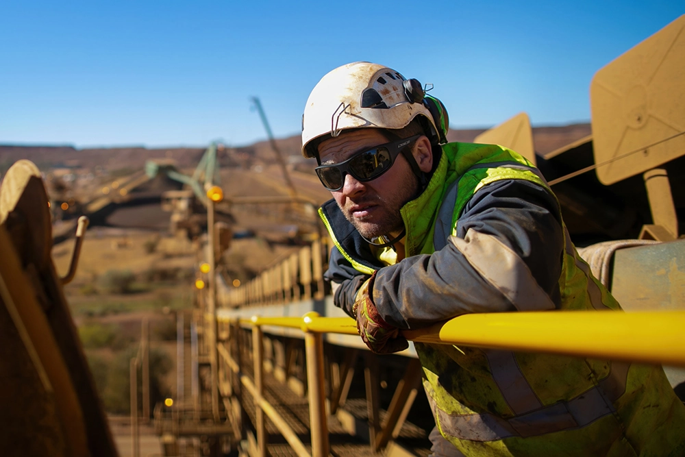 Man in high vis wearing sunglasses